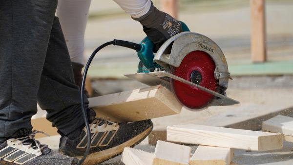 FILE - A workman cuts sections of a bean at a housing site in Madison County, Miss., March 16, 2021. A general co<em></em>ntractor who partners with a third-party lender to provide home improvement financing seems like a win-win: You get the renovation done by your co<em></em>ntractor of choice, and it simplifies the question of how to pay for it. But co<em></em>ntractors specialize in building and repairing, not financing, and they may not offer the best option. Loans through co<em></em>ntractors are often unsecured perso<em></em>nal loans, which can have higher interest rates than other financing options. (AP Photo/Rogelio V. Solis, file)