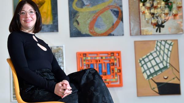Managing Director Bridget Finn poses among artwork from more than 150 Detroit artists during the Get Together gallery exhibition at her art gallery called, Reyes Finn, on Trumbull at Labrosse in Corktown, Wednesday afternoon, March 8, 2023. A majority of the artwork is for sale from $200-$24,000.