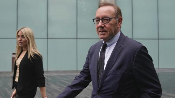 Actor Kevin Spacey, right, arrives at the Southwark Crown Court after lunch break in London, Britain, Friday, July 14, 2023.