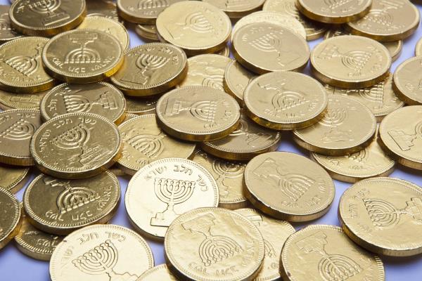 chocolate hanukkah gelt gold coins on gray background 